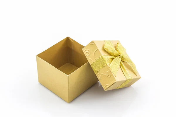 Gyllene presentförpackning med band rosett . — Stockfoto