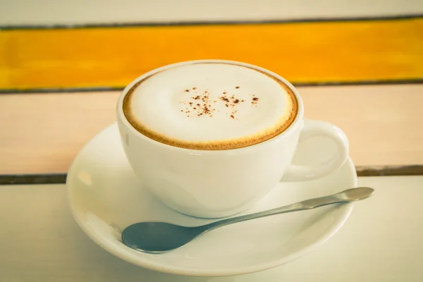 Cappuccino or latte coffee on wooden table. — Stock Photo, Image