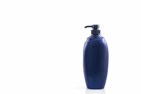 Dark blue bottle on a white background, for shampoo of washing o — Stock Photo, Image