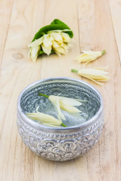 Water drink with Champaka flower. — Stock Photo, Image