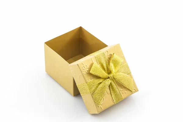 Golden gift box with ribbon bow. — Stock Photo, Image