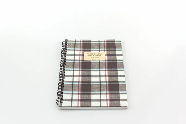 Fabric plaid texture cover spiral notebook. — Stock Photo, Image