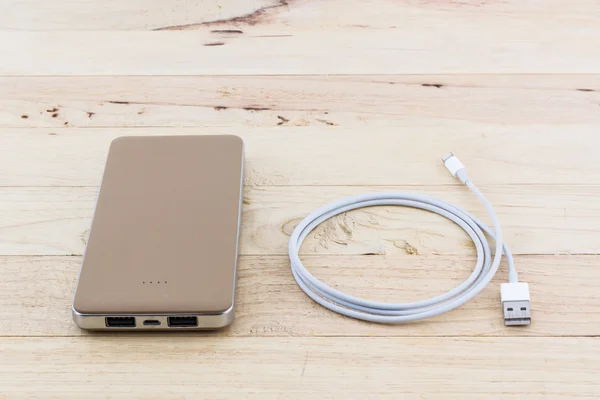 Smartphone with golden power bank. — Stock Photo, Image
