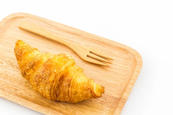 Fresh croissant in wooden plate. — Stock Photo, Image