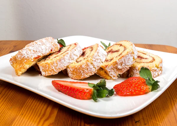 Swiss roll with strawberry jam — Stock Photo, Image