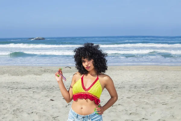 beautiful and sexy latina women enjoying her beach vacation with crochet bikini. brazilian woman