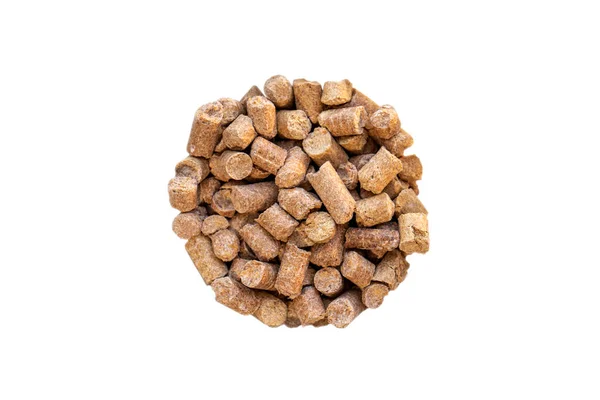 Wheat bran pellet isolate in the shape of a circle. Stern. View from above