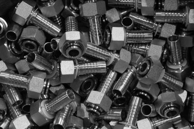 There are many metal wrench fittings for connecting polymer pipes for various purposes. Background, texture. Industrial equipment. Plumbing equipment.