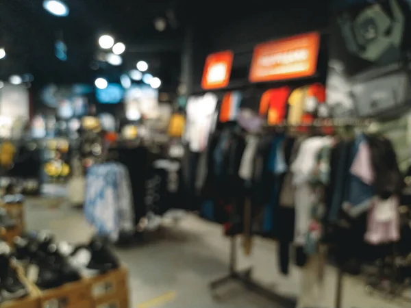Blurred background, store of things, shoes and accessories in the mall. As a person with poor eyesight sees. Myopia.
