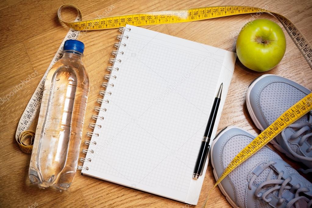 Sneakers, Centimeter, Green Apple, Notebook,  Bottle Of Water. Weight Loss,  Healthy Lifestyle Concept