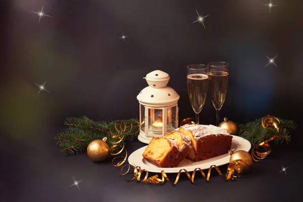 Christmas Cake Candied Fruits Raison Two Glasses Champagne Burning Lantern — Stock Photo, Image