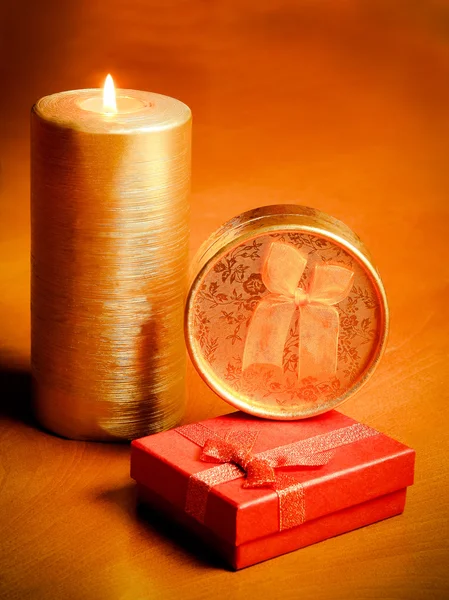 Candle and gift boxes — Stock Photo, Image