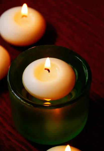 Glass candlesticks and candles on wooden table. Selective focus — 스톡 사진