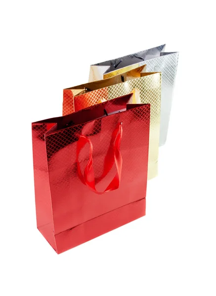 Bunch sacos de papel coloridos para presentes isolados em branco — Fotografia de Stock