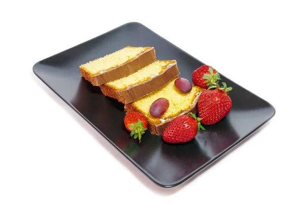 Cake with glaze of chocolate and strawberries  in the black dish — Stock Photo, Image