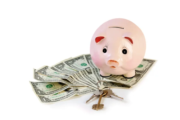 Piggy bank with house keys  and money isolated on white — Stock Photo, Image