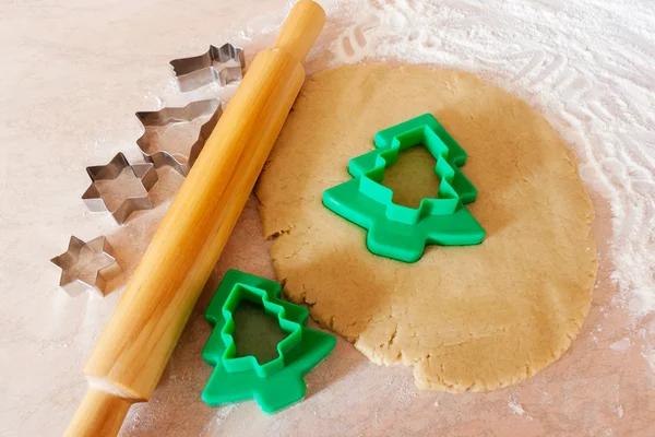 Forms for the cookies, rolling pin and dough — Stock Photo, Image