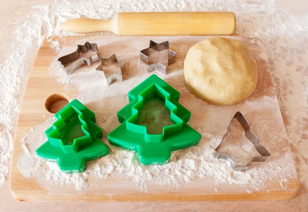 Forms for the cookies, rolling pin and dough — Stock Photo, Image