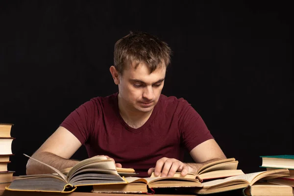 Young Student Sits His Hands His Head Table Books Black — Stock Photo, Image