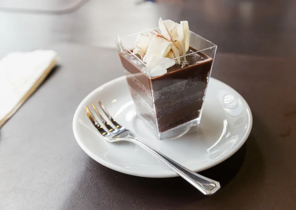 Chocolate cake in square glass — Stock Photo, Image