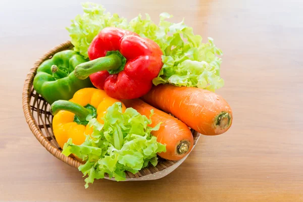 Healthy vegetable in basket put on wooden table — Stock Photo, Image