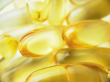 Birçok Omega 3 kapsülünün yakın çekim dokusu. Çoklu doymuş yağ asitleri. Sağlıklı yaşam tarzı kavramı. 