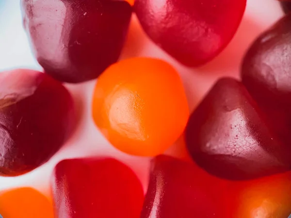 stock image Close-up texture of red, orange and purple multivitamin gummies. Healthy lifestyle concept