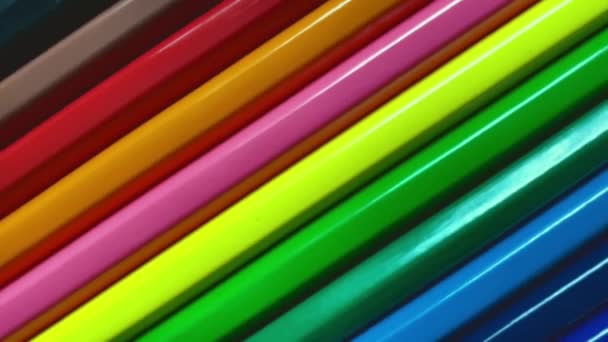 Colored pencils revolve around the axis close-up. Creative video, education concept — Stock Video