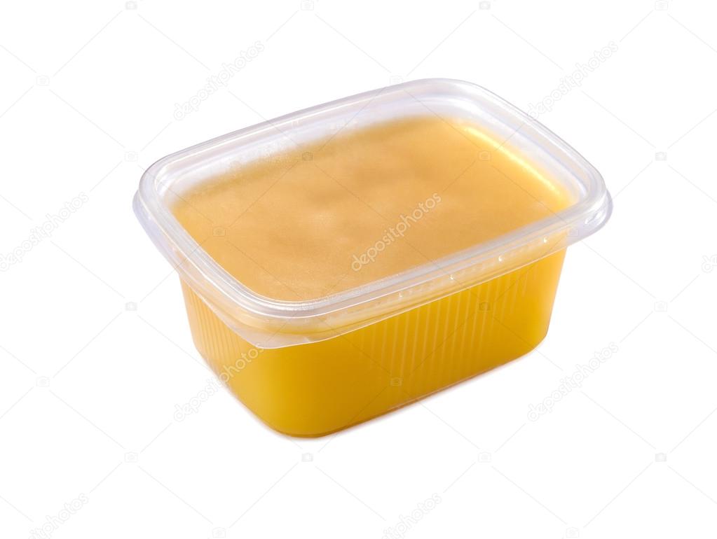 plastic container with ghee butter isolated — Stock Photo © niknikpo