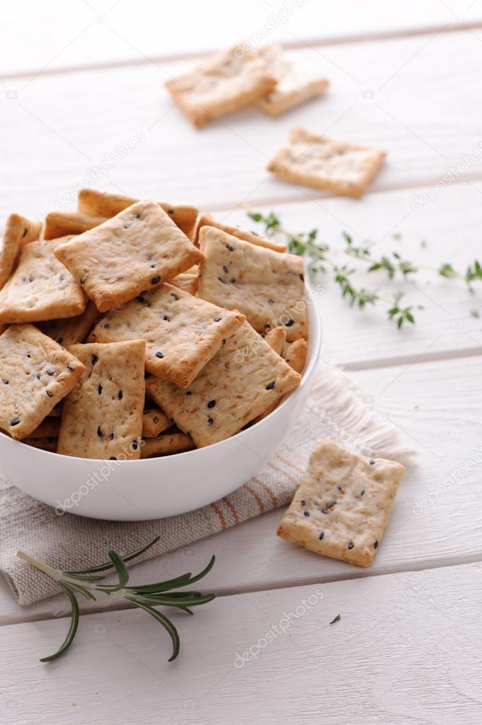 crackers with herbs and black sesame seeds on table