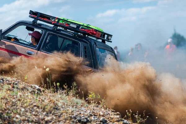 Buggy Moves On A Dusty Road. A lot of dust. UTV, ATV