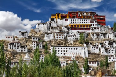 Thiksey Monastery in Clouds and Blue Sky, India clipart