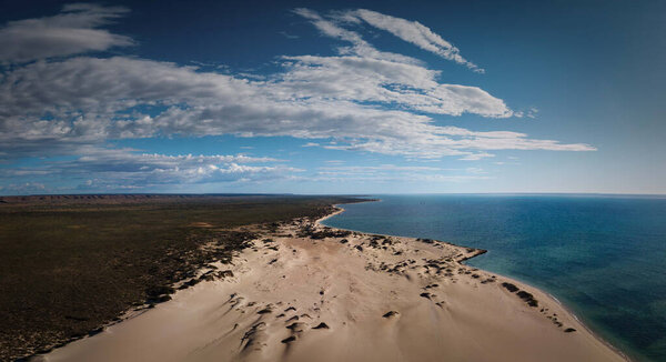 An aerial view of sand dunes and the beach in the Shark Bay region of Western Australia.