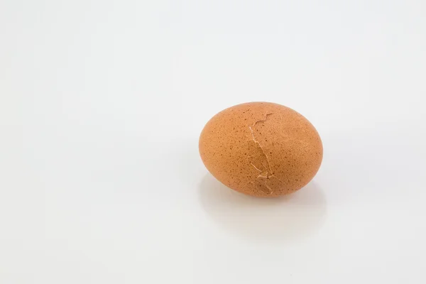 Cracked breakfast egg on white background — Stock Photo, Image