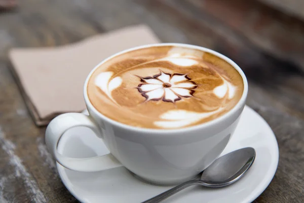 Art latte coffee on white cup — Stock Photo, Image