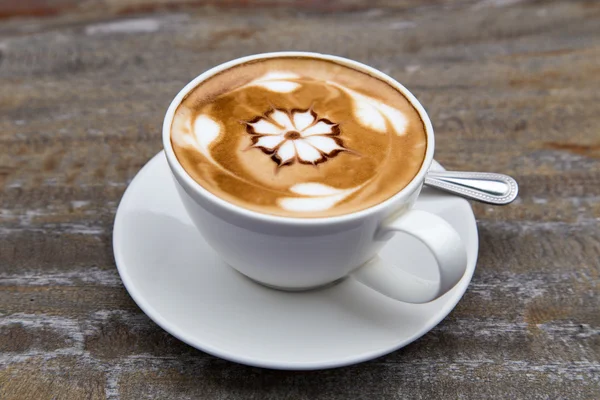 Art latte coffee on white cup — Stock Photo, Image