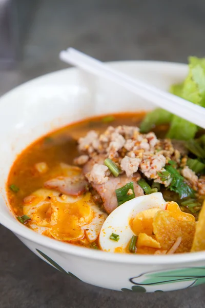 Thai noodle soup in a bowl taste spicy noodle soup.