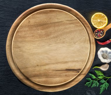 Wooden cutting board and spices clipart