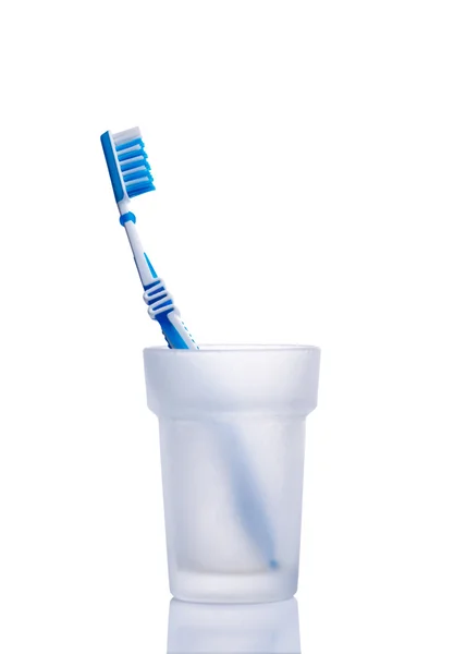 Toothbrush in glass on white — Stock Photo, Image