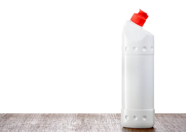 Бутылка детергента на столе — стоковое фото