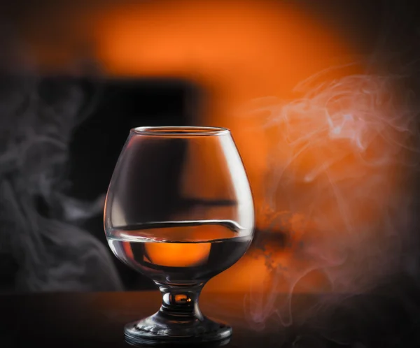 Glass of brandy on table — Stock Photo, Image