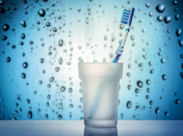 Toothbrush in glass on shelf — Stock Photo, Image