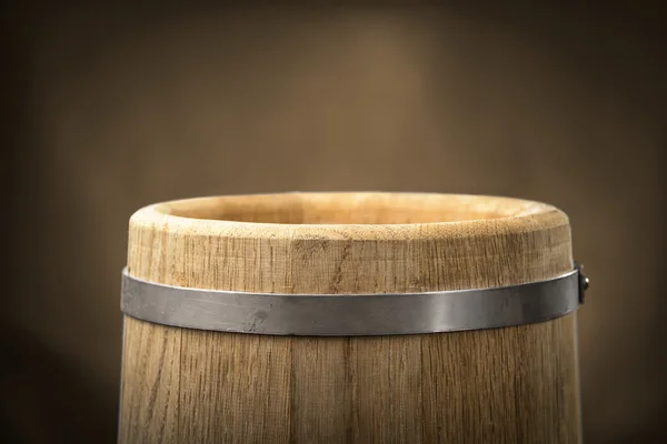 Barrel on a brown background — Stock Photo, Image