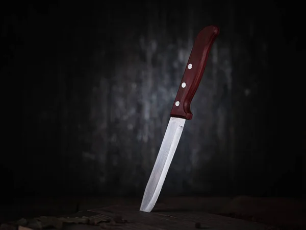 Kitchen knife in a cutting board