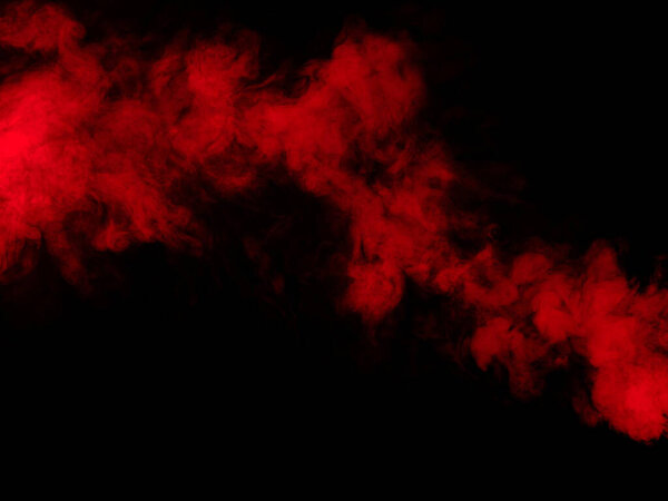 Red smoke isolated on dark background