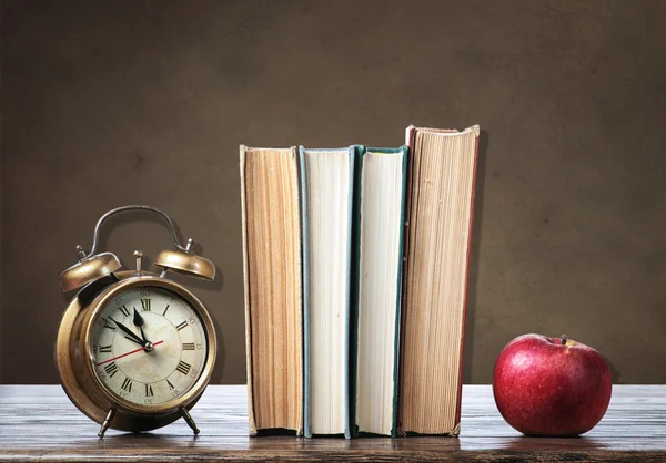 Books on wooden desk — Stock Photo, Image