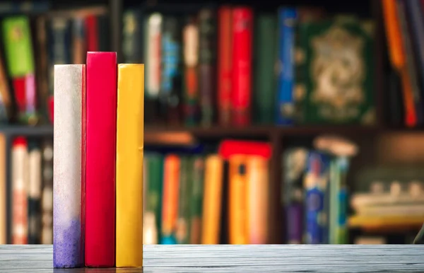 Books on wooden desk — Stock Photo, Image