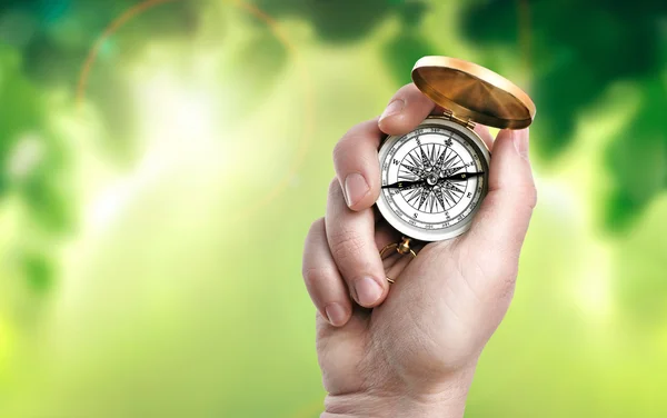 Compass in male hand — Stock Photo, Image