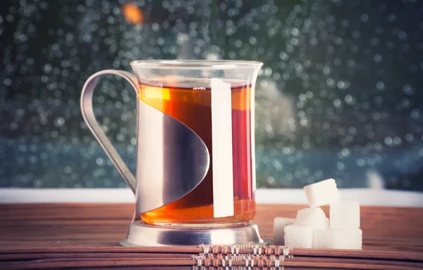 Copo de chá, suporte de xícara e açúcar — Fotografia de Stock