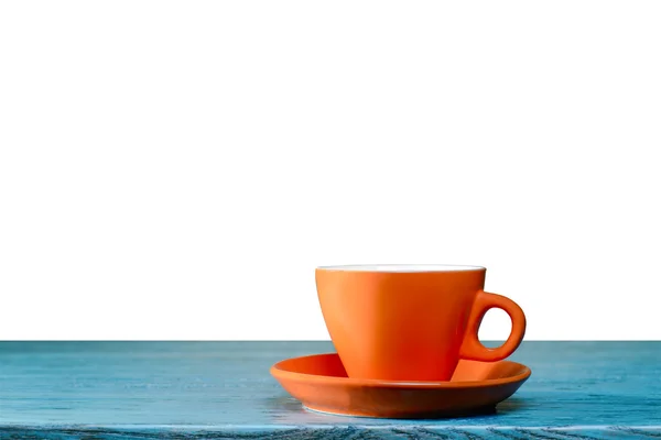 Copo laranja na mesa azul — Fotografia de Stock